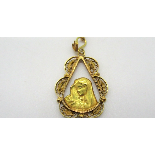 203 - 18ct yellow gold religious pendant in filigree tear drop mount L3cm on a chain with spring ring clas... 