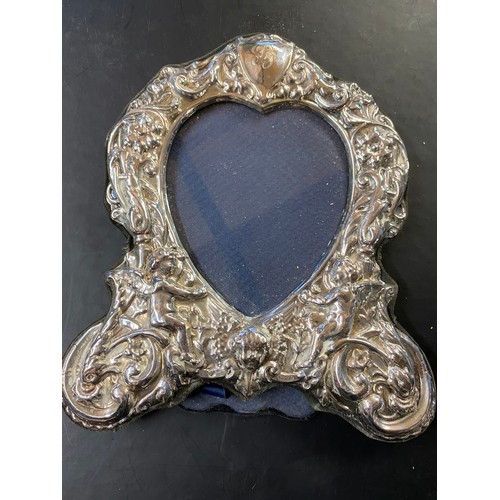 195 - Sterling silver photograph frame with repousse decoration, London, 1988