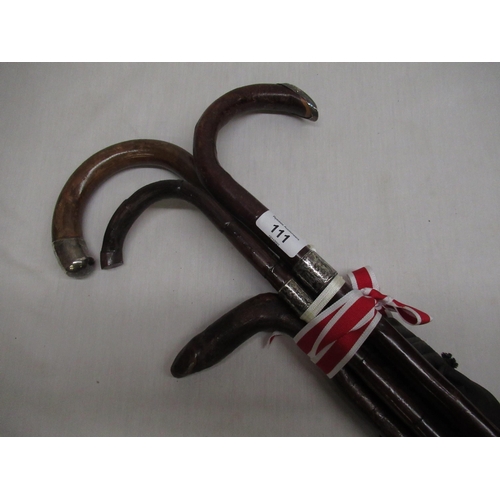 86 - Early C20th umbrella with hallmarked silver collar, two other walking sticks with hallmarked silver ... 