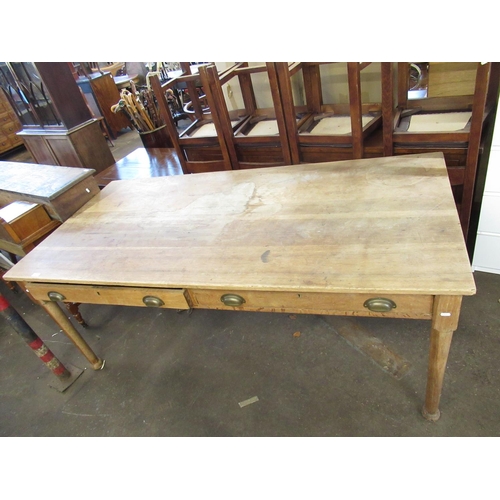 79 - Early C20th light oak two drawer table on pad feet W889cm L183cm H75cm