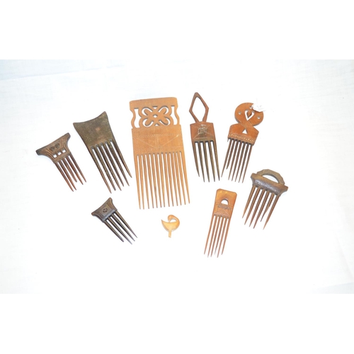 298 - Selection of eight African carved wood combs of various sizes and design (8)