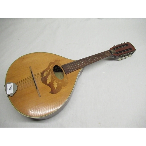 38 - Mid C20th bowl back 17 fret Mandolin with inlaid foliage detail around the sound hole, made in Reghi... 