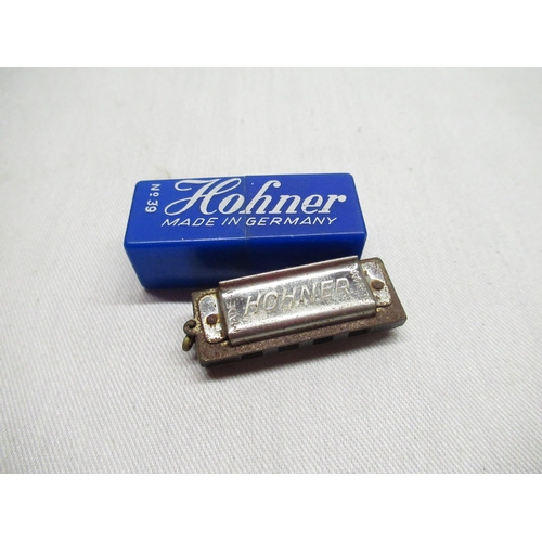 142 - Two graduated Limoges France, miniature porcelain boxes with hinged lids and hand painted decoration... 