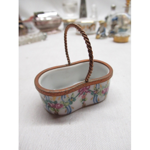 142 - Two graduated Limoges France, miniature porcelain boxes with hinged lids and hand painted decoration... 