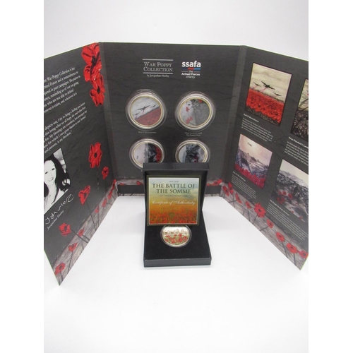 744 - War Poppy Collection including four coins in fitted case and a The Battle Somme £5 proof cupro-nicke... 