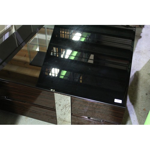 761 - Unusual modern coffee table with mirrored panels, two drawers either end, wood effect, black glass t... 