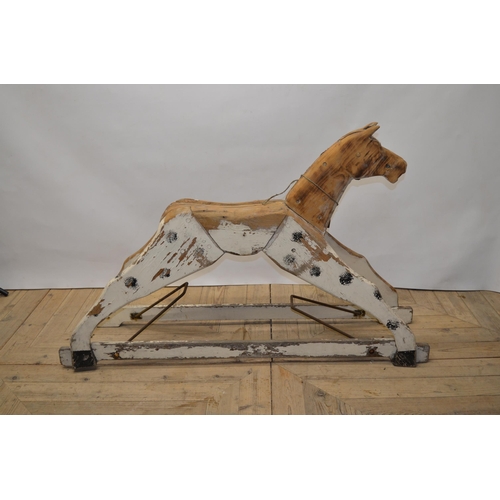 215 - Carved wood striped rocking horse figure with swing rocker type base, H79cm