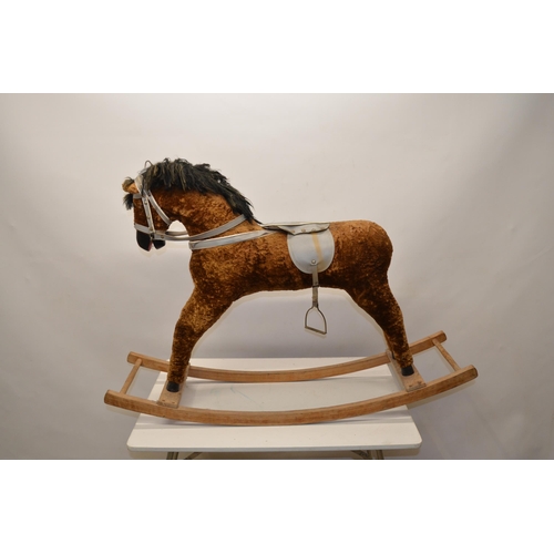 218 - Vintage wooden fur lined rocking horse with grey leather saddle and reins, with one stirrup, L105cm ... 