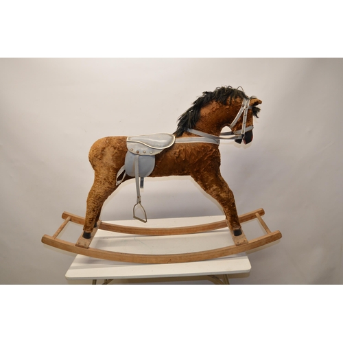 218 - Vintage wooden fur lined rocking horse with grey leather saddle and reins, with one stirrup, L105cm ... 