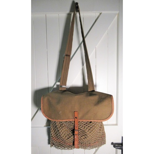 2108 - Leather trimmed green canvas game bag containing game net, a wooden and antler handled skinning knif... 