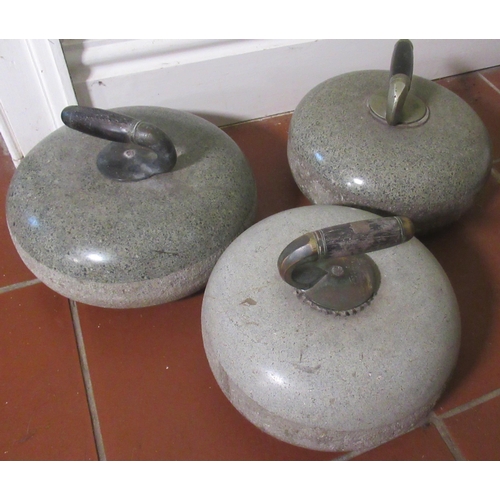 2064 - Three polished Scottish granite curling stones, chromed handles with wooden grips, D36cm (3)