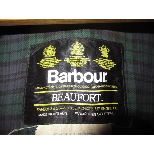 2076 - Vintage Barbour Beaufort waxed cotton jacket, C42/107cm, green tartan lining, torn, and two Barbour ... 