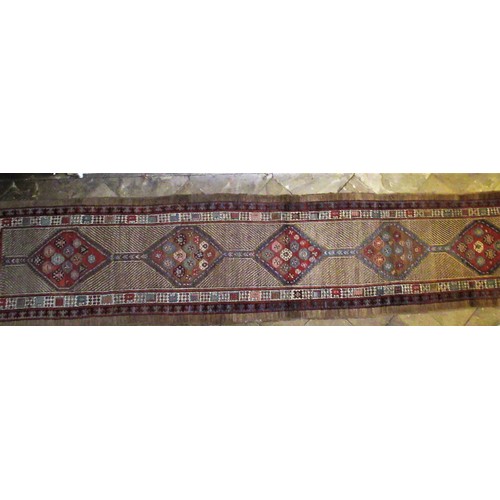2015 - Caucasian multicoloured runner, the striped field with five joined stepped medallions, within a twin... 