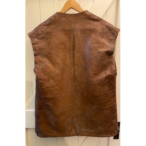 2084 - C20th tan leather jerkin, with four buttons, and blanket lining