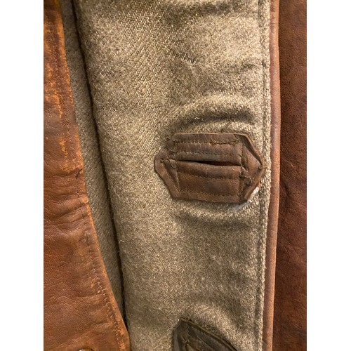 2084 - C20th tan leather jerkin, with four buttons, and blanket lining