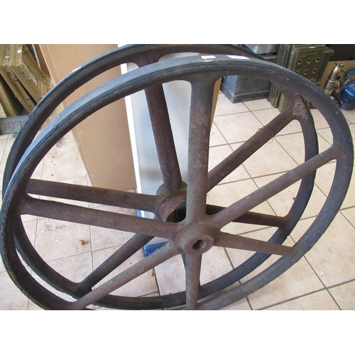60 - Pair of six spoke cast iron flywheels with rubber rims, D92cm