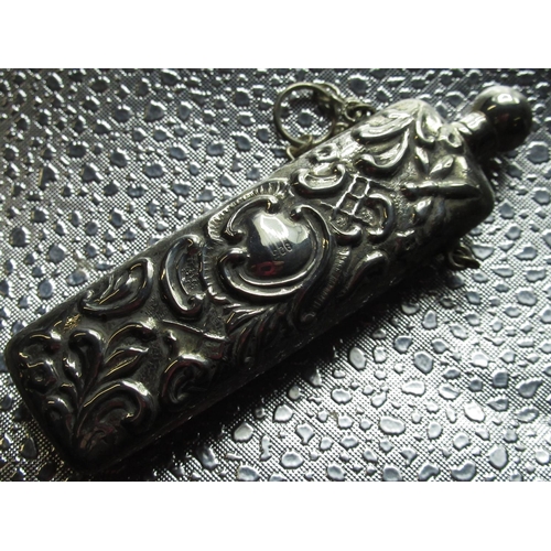 18 - Sterling silver repoussé decorated scent bottle with screw top stamped 925 L9cm, another similar sma... 
