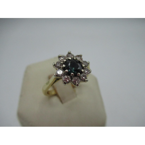 26 - 18ct yellow gold cluster ring with central tourmaline surrounded by ten round cut diamonds, mount W1... 