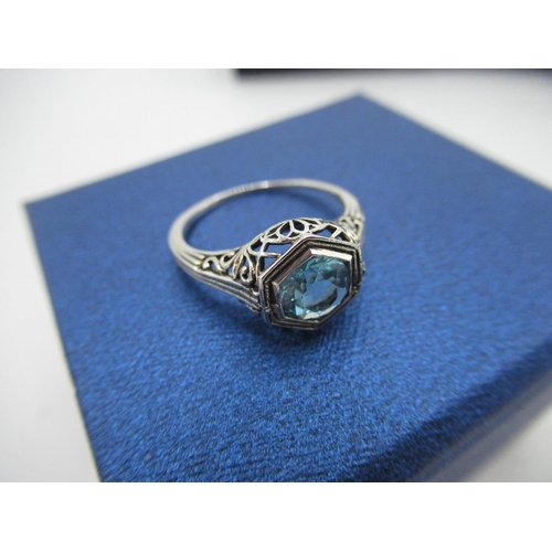 41 - Sterling silver rings with hexagonal turquoise stone in a pierced decorative mount stamped 925 size ... 