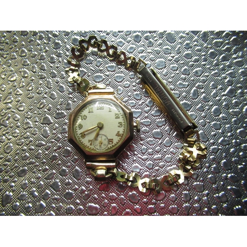 10 - Mid C20th ladies cocktail watch in 9ct gold case and yellow metal strap