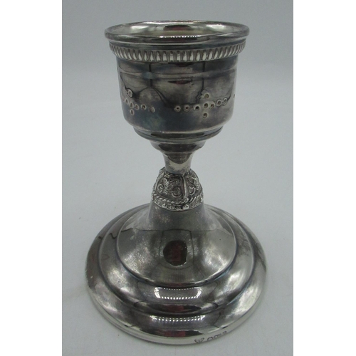 54 - Hallmarked Sterling silver candlestick with pierced and relief decorated column by Garrard & Co Ltd,... 