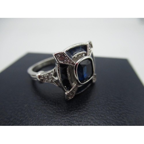 30 - Sterling silver halo ring with central square blue stone ring surrounded by white stones, Size O 1/2... 