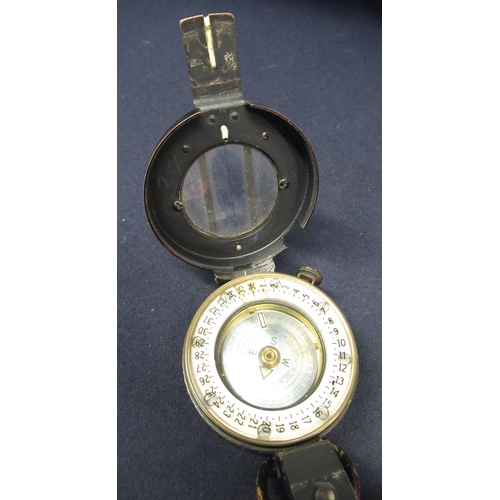 125 - T. G. & Co marching compass with registration no. 218230, with crowsfoot military arrow dated 1943, ... 