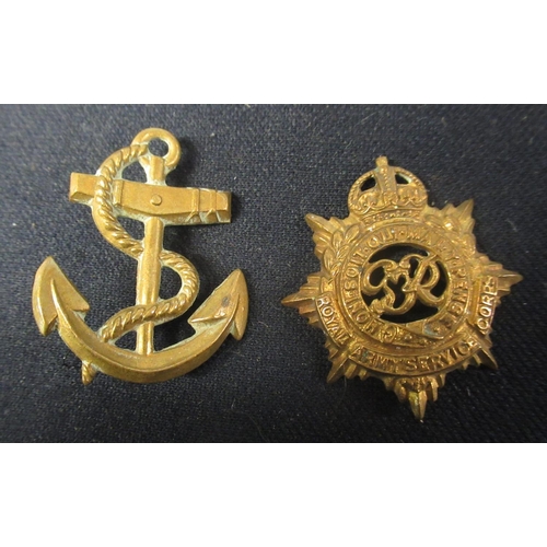 301 - Collection of ten pieces of military insignia including Royal Navy, Torpedo Training Anchor, WWI Geo... 