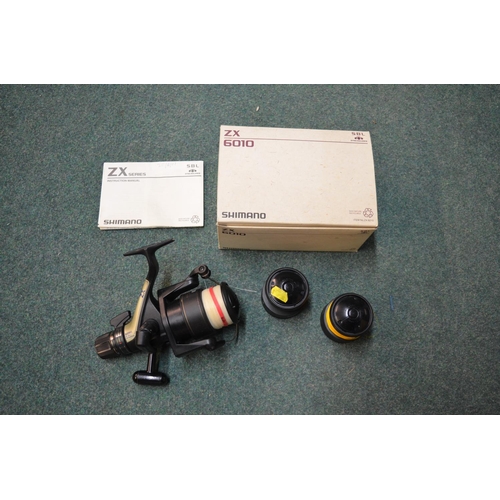 152 - Boxed Shimano 6010ZX Baitrunner fishing reel, with two spare spools and instructions (4)