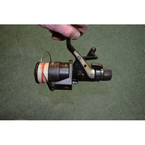 152 - Boxed Shimano 6010ZX Baitrunner fishing reel, with two spare spools and instructions (4)