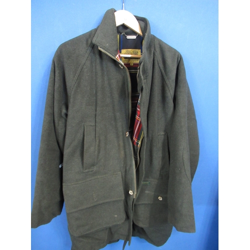 12 - Hucklecote sporting jacket with outside pockets and handwarming pockets, zip and buttons, with tarta... 