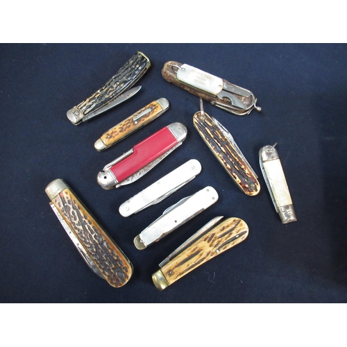 173 - Nine pocketknives with various handles including pearl and antler, makers including Thomas and Turne... 