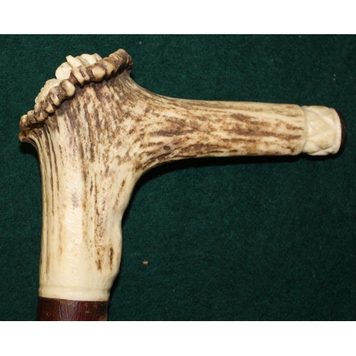 37 - Shepherds crook walking stick with cherry shank and antler handle with ornate carving of flying grou... 
