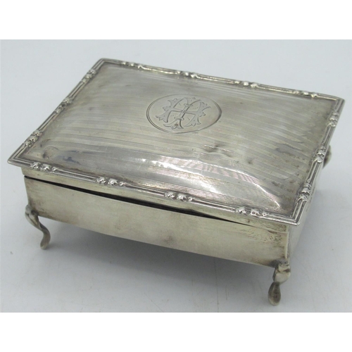 106 - Geo.V hallmarked Sterling silver ring box with initialled and engine turned lid on cabriole legs, wi... 