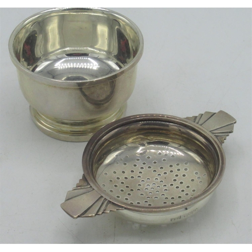 112 - Geo.V Art Deco hallmarked Sterling silver tea strainer and stand with geometric handles and stepped ... 