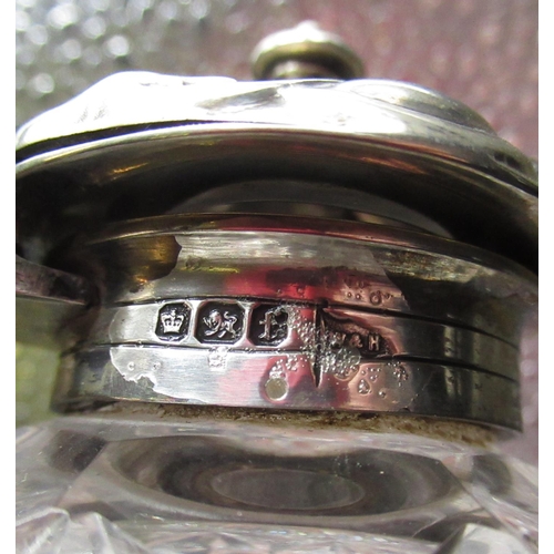 55 - Victorian cut glass ink well with hallmarked Sterling silver repoussé hinged lid, on lobed circular ... 