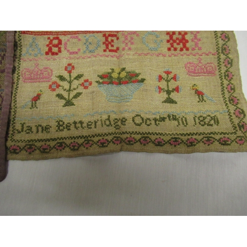 255 - Geo. IV wool work sampler, worked with upper and lowercase alphabet, motto and stylised fruit basket... 