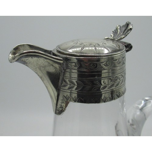 34 - Victorian cut glass claret jug of baluster form with hallmarked Sterling silver top of etched repeat... 