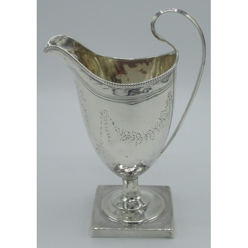 1163 - Geo.III hallmarked Sterling silver helmet shaped cream jug, bright cut and monogrammed with beaded b... 