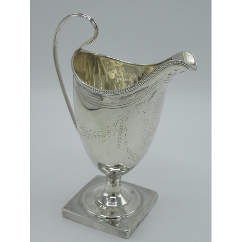 1163 - Geo.III hallmarked Sterling silver helmet shaped cream jug, bright cut and monogrammed with beaded b... 