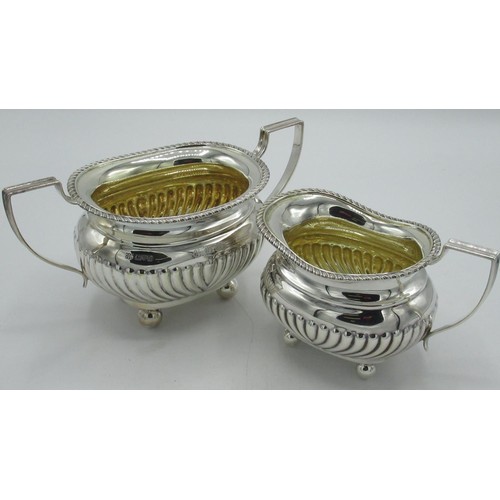 1165 - Geo.V hallmarked Sterling silver two handled sugar bowl and milk jug with lobed body, angular hndles... 