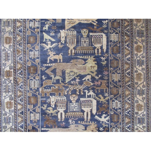 345 - C20th Persian pattern rug, blue ground with central field set with stylized animals including deer a... 