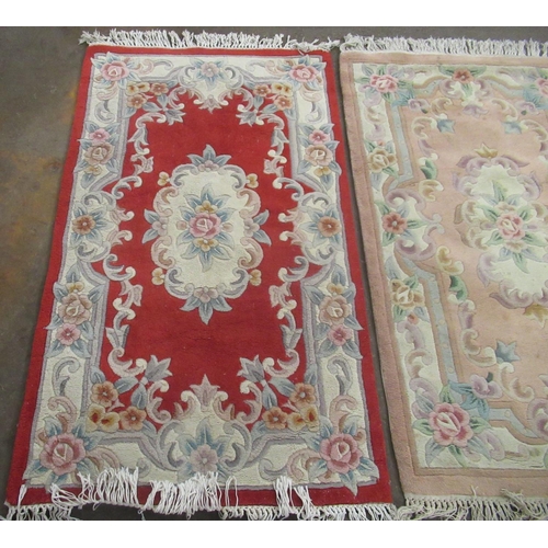 347 - Two late C20th Chinese embossed washed woolen rugs, one beige ground, the other red ground, both wit... 