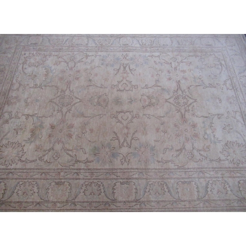 358 - Late C20th traditional pattern wool rug, beige ground with central floral field and scrolling floral... 