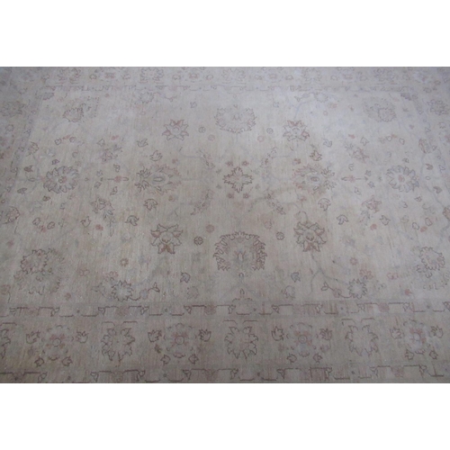 359 - Late C20th traditional pattern wool rug, beige ground with central floral field and scrolling floral... 