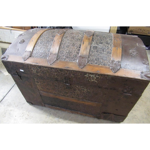 178 - Victorian wooden banded metal covered domed topped trunk, relief decorated with trailing leafage, hi... 