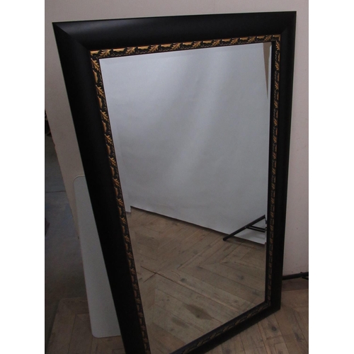 201 - Rectangular over mantel wall mirror, ebonised and gilt leaf moulded frame, W79cm H140cm