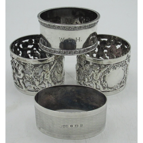 66 - Pair of Victorian hallmarked Sterling silver napkin rings, pierced with cherubs in woodland setting,... 