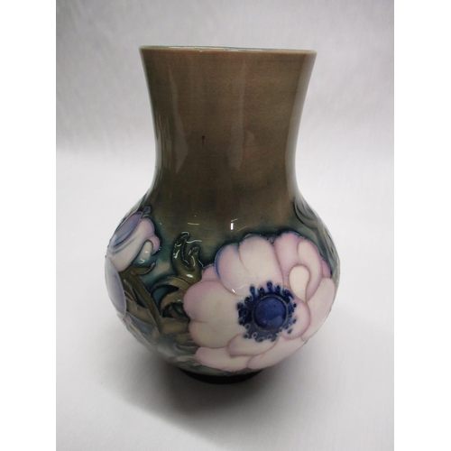 288 - Moorcroft baluster vase decorated in white and blue Anemone pattern on a green ground, impressed mar... 