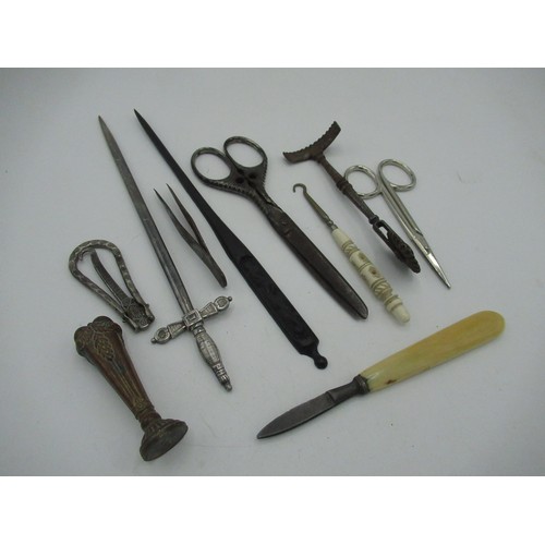 86 - WITHDRAWN - Collection of items including letter openers, a seal, tweezers and a glove button hook e... 